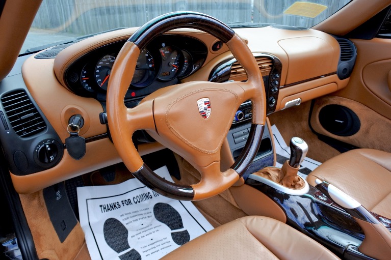 Used 2002 Porsche 911 Carrera C4 Cabriolet 6-Spd Man Used 2002 Porsche 911 Carrera C4 Cabriolet 6-Spd Man for sale at Metro West Motorcars LLC in Shrewsbury MA 21